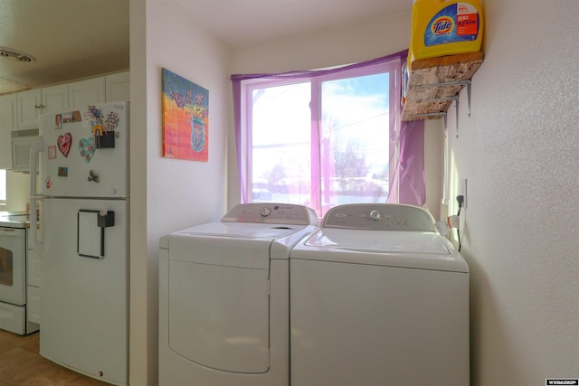 washroom featuring washer and dryer