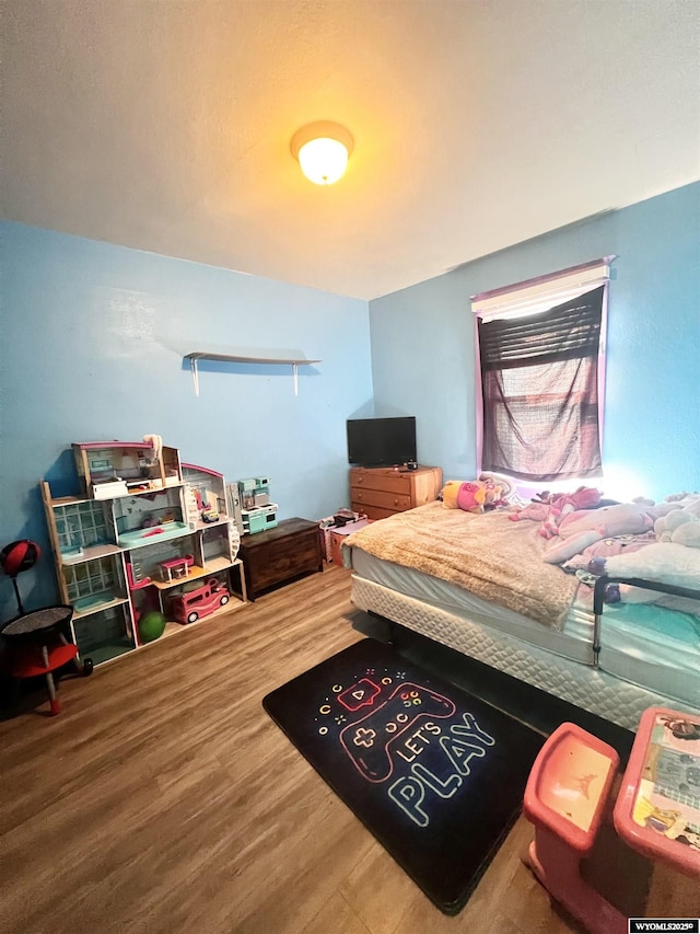 bedroom featuring hardwood / wood-style flooring