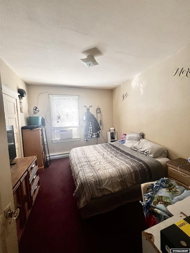 carpeted bedroom featuring cooling unit, a textured ceiling, and a baseboard heating unit