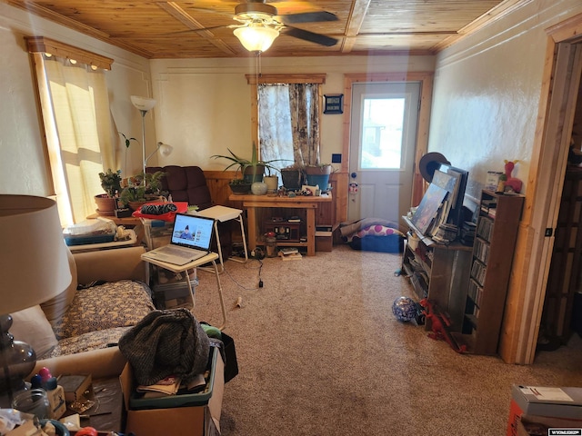 interior space featuring wooden ceiling, ceiling fan, and carpet