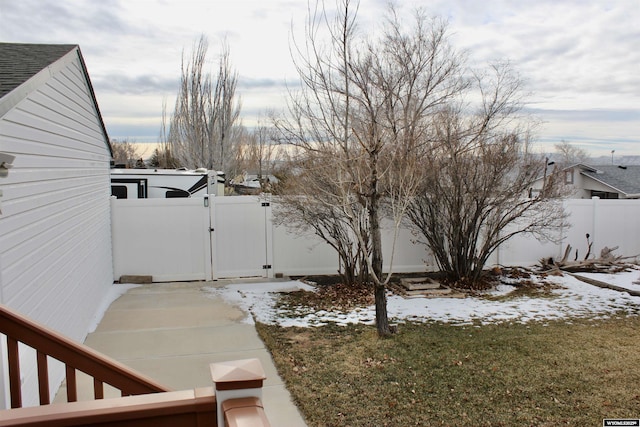 view of yard layered in snow