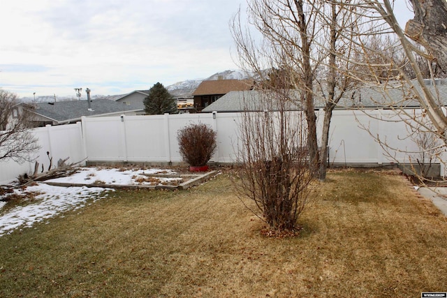 view of yard layered in snow