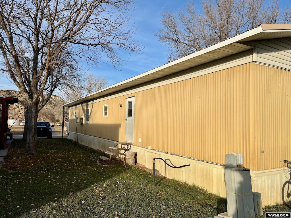 view of home's exterior with a yard