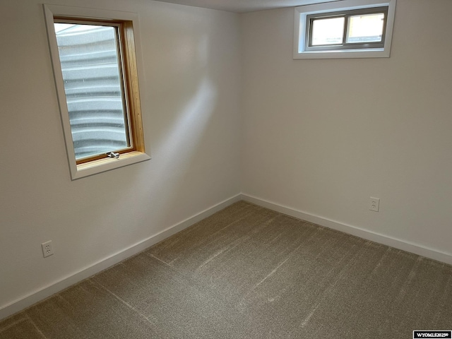 empty room with carpet flooring