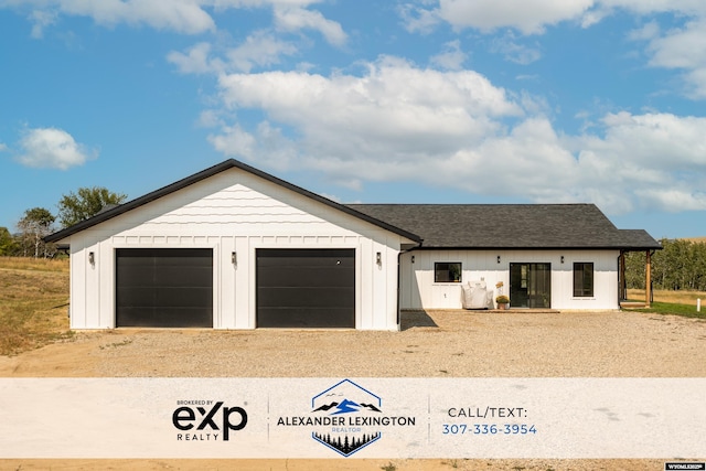 modern farmhouse style home featuring board and batten siding, a garage, roof with shingles, and dirt driveway