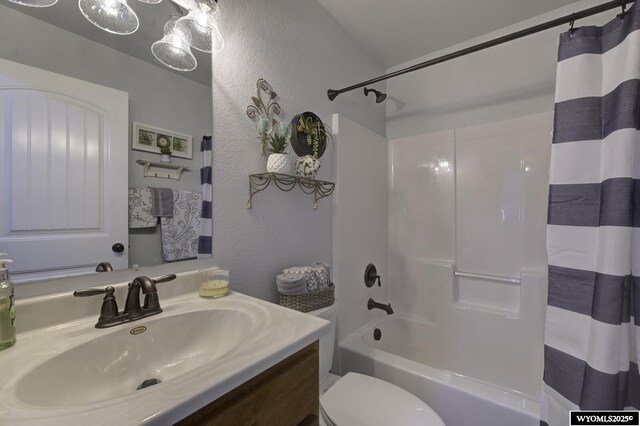 full bathroom with vanity, toilet, and shower / bathtub combination with curtain