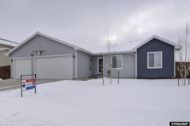 ranch-style home featuring a garage