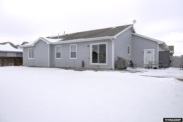 view of snow covered house