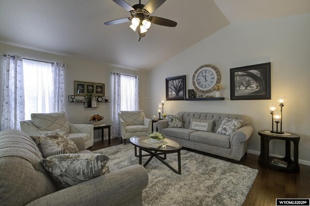 living room featuring ceiling fan, dark hardwood / wood-style flooring, and vaulted ceiling