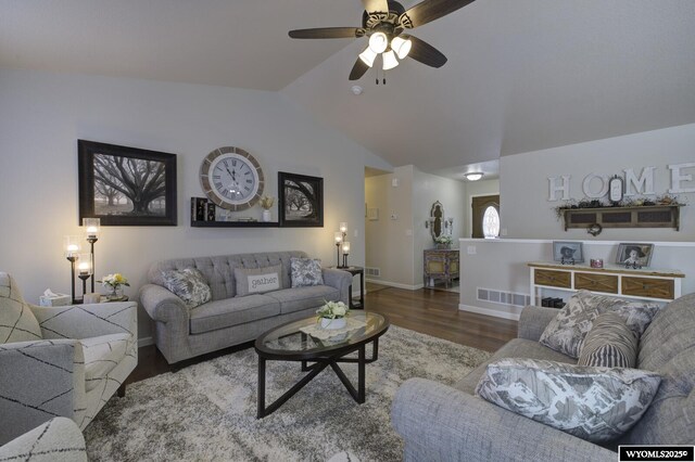 living room with ceiling fan, lofted ceiling, and hardwood / wood-style flooring