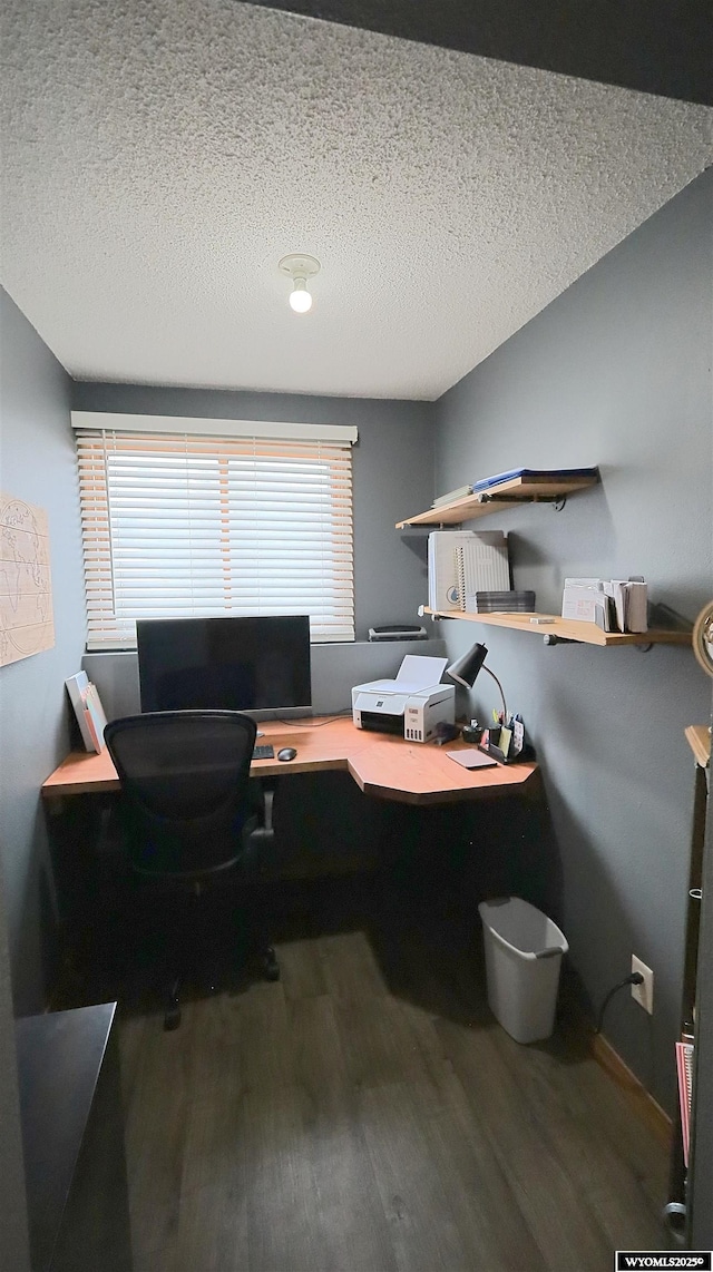 office area featuring hardwood / wood-style flooring, a textured ceiling, and a wealth of natural light