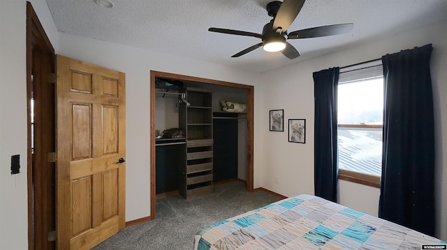 carpeted bedroom featuring ceiling fan, a closet, and a textured ceiling