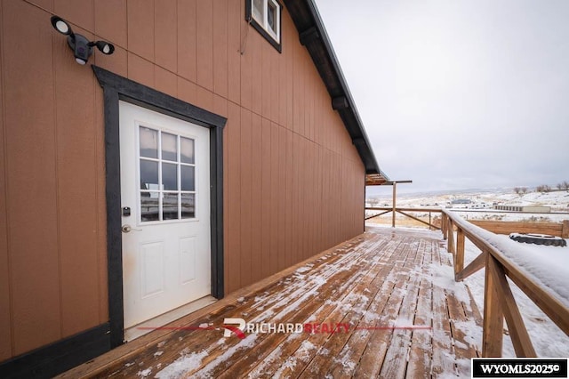 view of snow covered property entrance