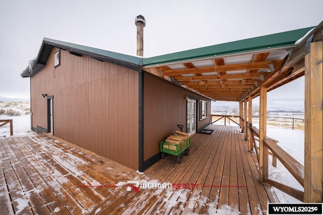 view of snow covered deck