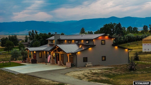 view of front facade featuring a mountain view and a patio