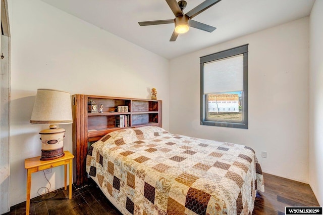 bedroom with ceiling fan and dark hardwood / wood-style floors