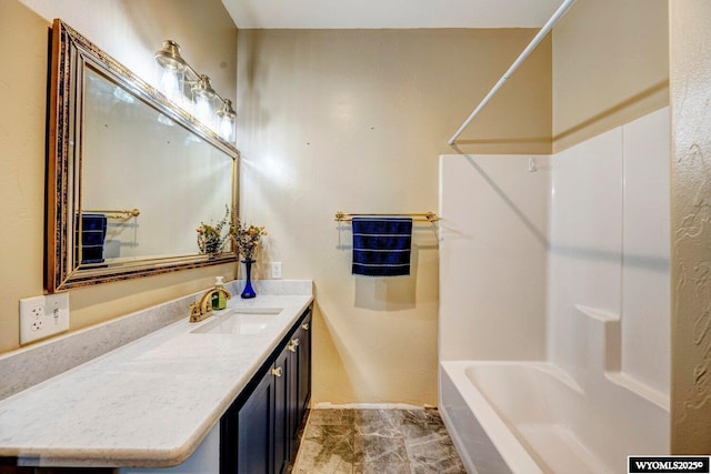 bathroom with vanity and shower / tub combination