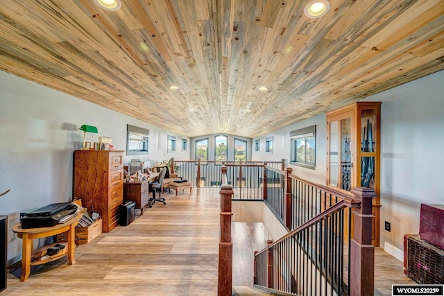 interior space with french doors, light wood-type flooring, vaulted ceiling, and wooden ceiling