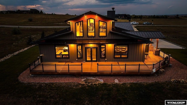 view of back house at dusk