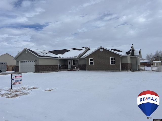 ranch-style house featuring a garage