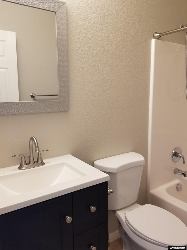 full bathroom featuring vanity, shower / bathtub combination, and toilet