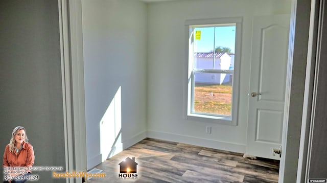 unfurnished room featuring wood-type flooring