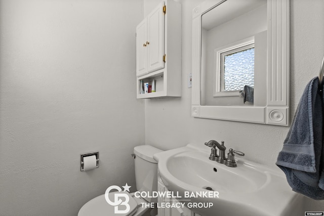 bathroom featuring sink and toilet