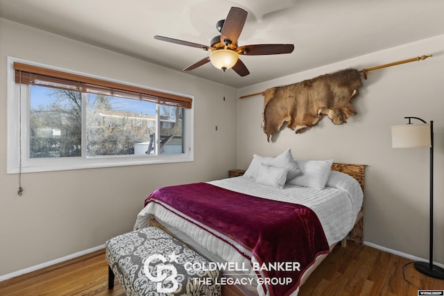 bedroom featuring hardwood / wood-style flooring and ceiling fan