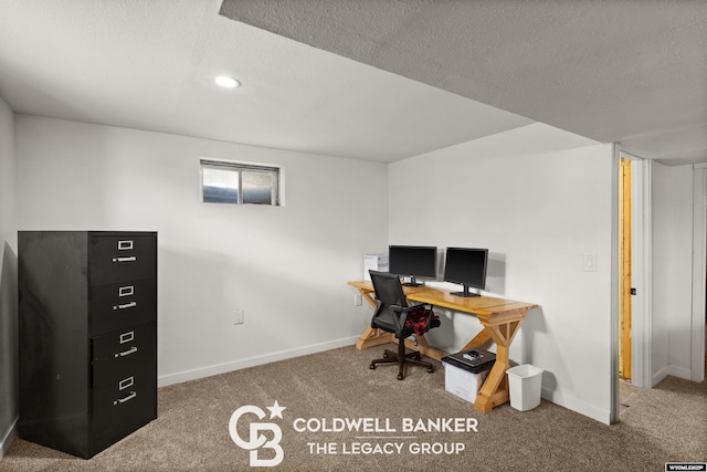 office area featuring carpet flooring and a textured ceiling