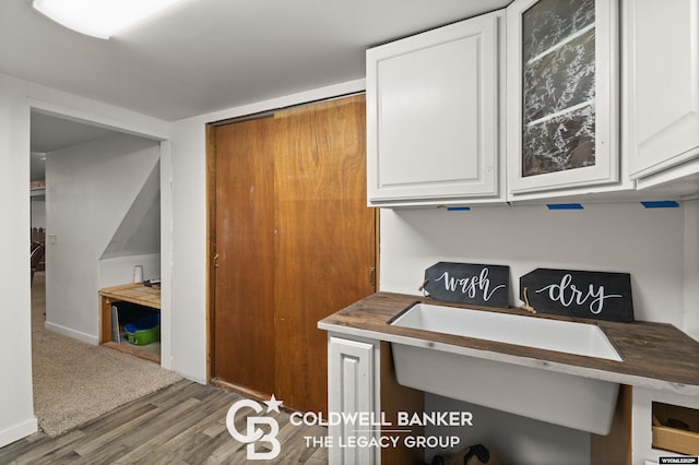 kitchen with white cabinetry and dark hardwood / wood-style flooring