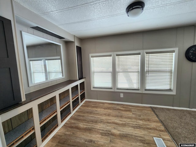 unfurnished room featuring hardwood / wood-style flooring