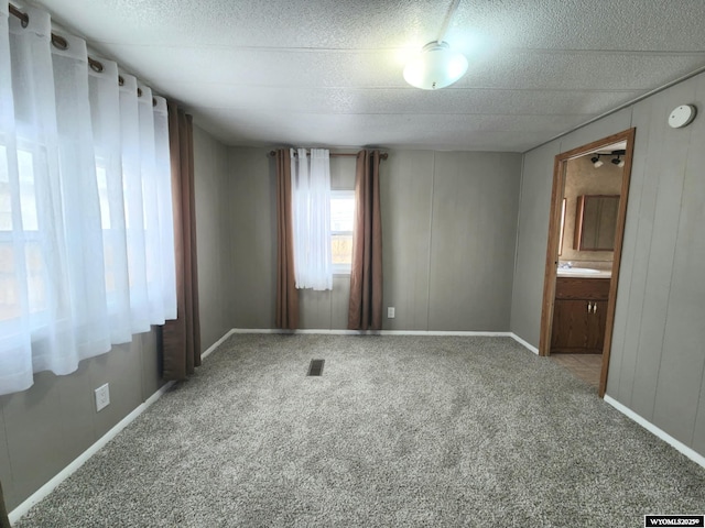 carpeted empty room with sink