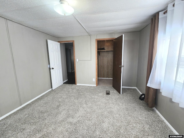 unfurnished bedroom with carpet flooring