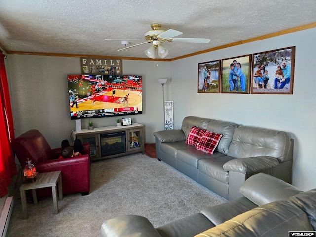 living room with carpet flooring, ceiling fan, a baseboard heating unit, a textured ceiling, and ornamental molding