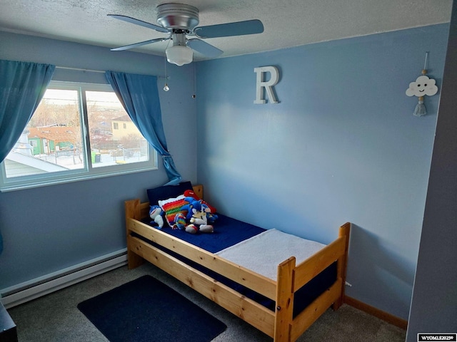 carpeted bedroom with a textured ceiling, baseboard heating, and ceiling fan