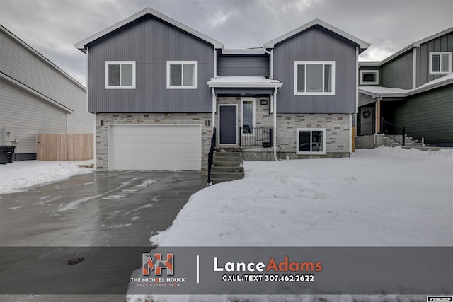 bi-level home featuring a garage