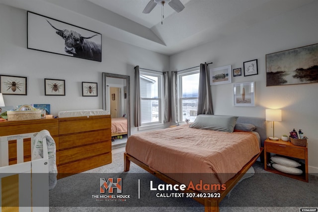 bedroom with vaulted ceiling, carpet flooring, and a ceiling fan