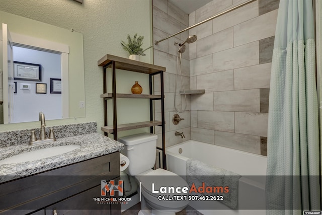 full bathroom with toilet, a textured wall, shower / bath combination with curtain, and vanity