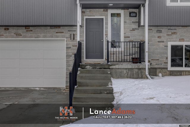 property entrance featuring a garage