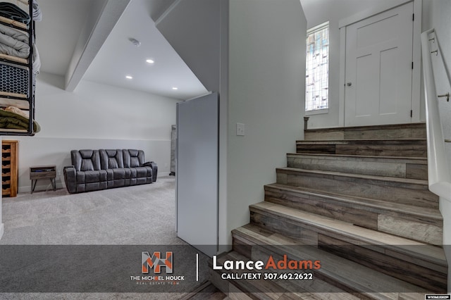 staircase with beamed ceiling, carpet flooring, and recessed lighting