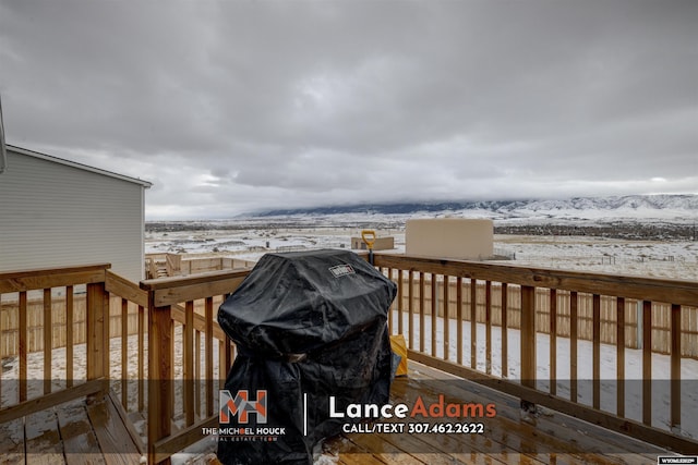 view of snow covered deck