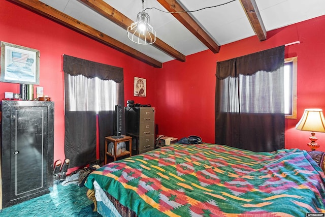 bedroom featuring beamed ceiling