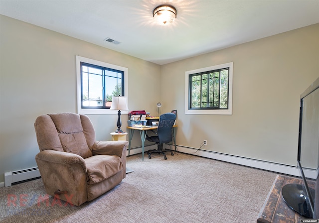 carpeted office space with a healthy amount of sunlight and baseboard heating