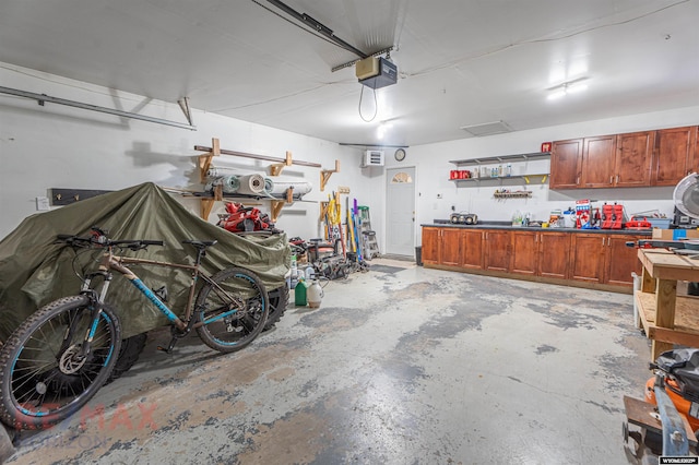 garage featuring a workshop area and a garage door opener