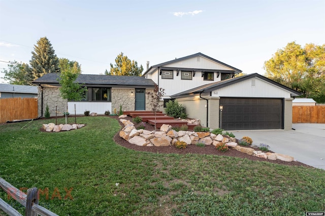 view of front facade with a garage and a front lawn