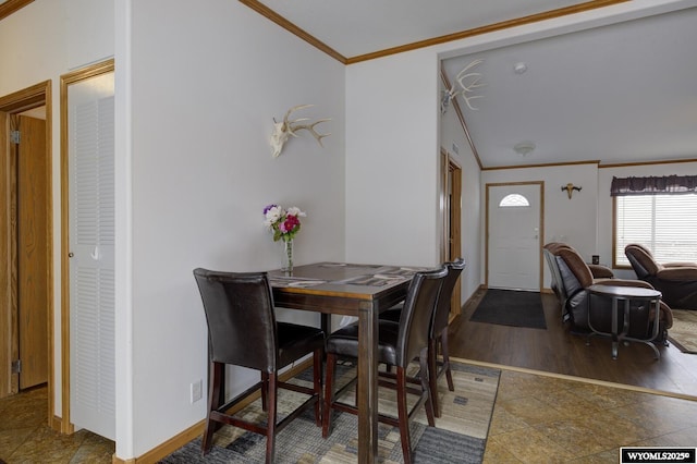 dining space with crown molding