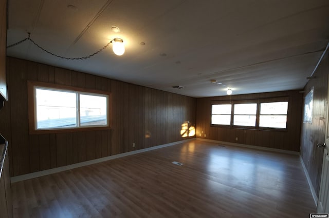 spare room with hardwood / wood-style flooring