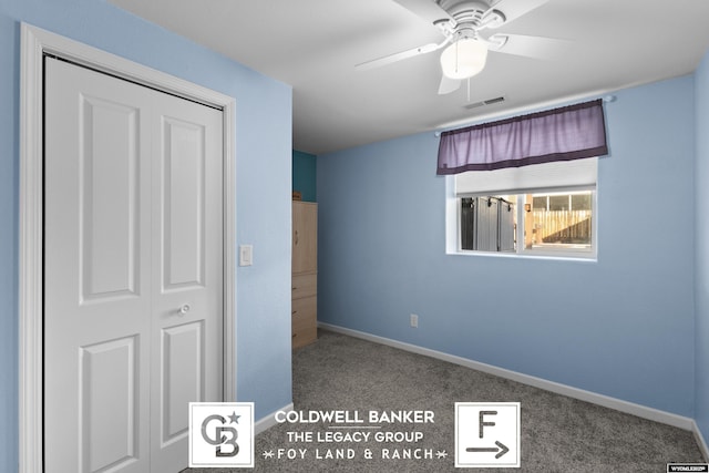 unfurnished bedroom featuring carpet, a closet, and ceiling fan