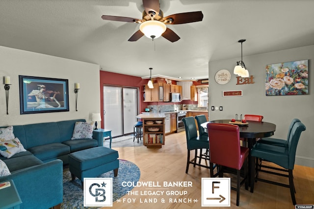 dining room featuring ceiling fan and light hardwood / wood-style flooring