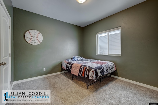 bedroom featuring light carpet